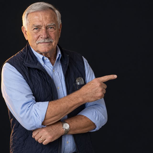 Gene Harlan pointing to the savings figures